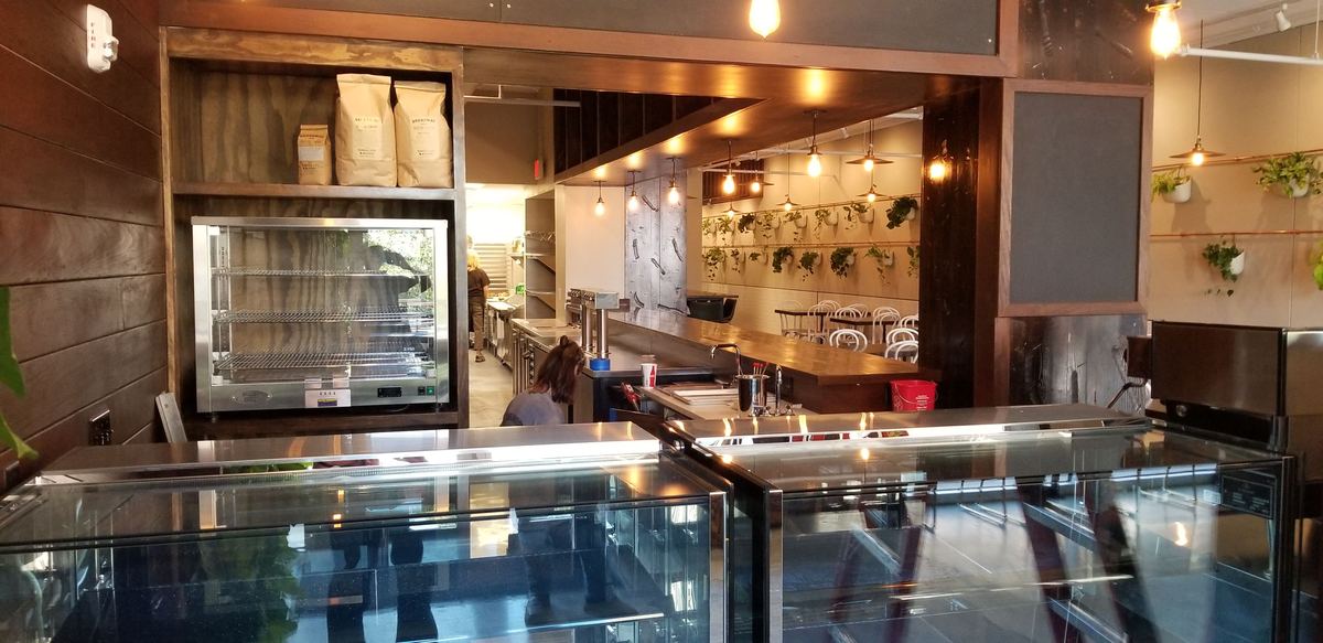 Restaurant interior with display cases and seating