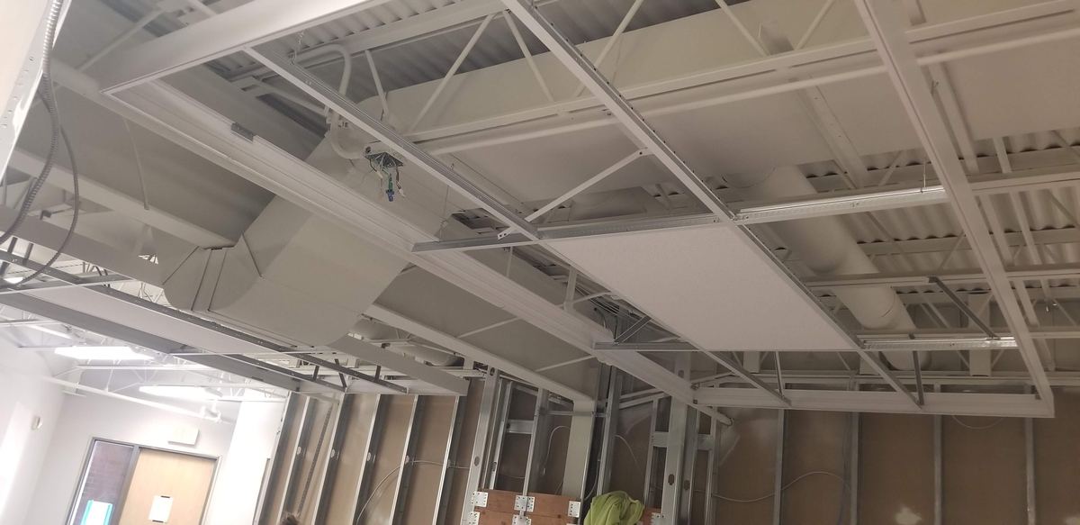 Open steel roof structure before ceilings